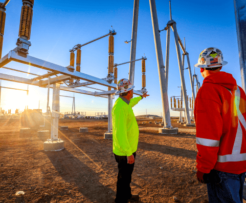 Two Employees testing at Power substation