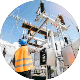 A Person Standing Infront of current Substation